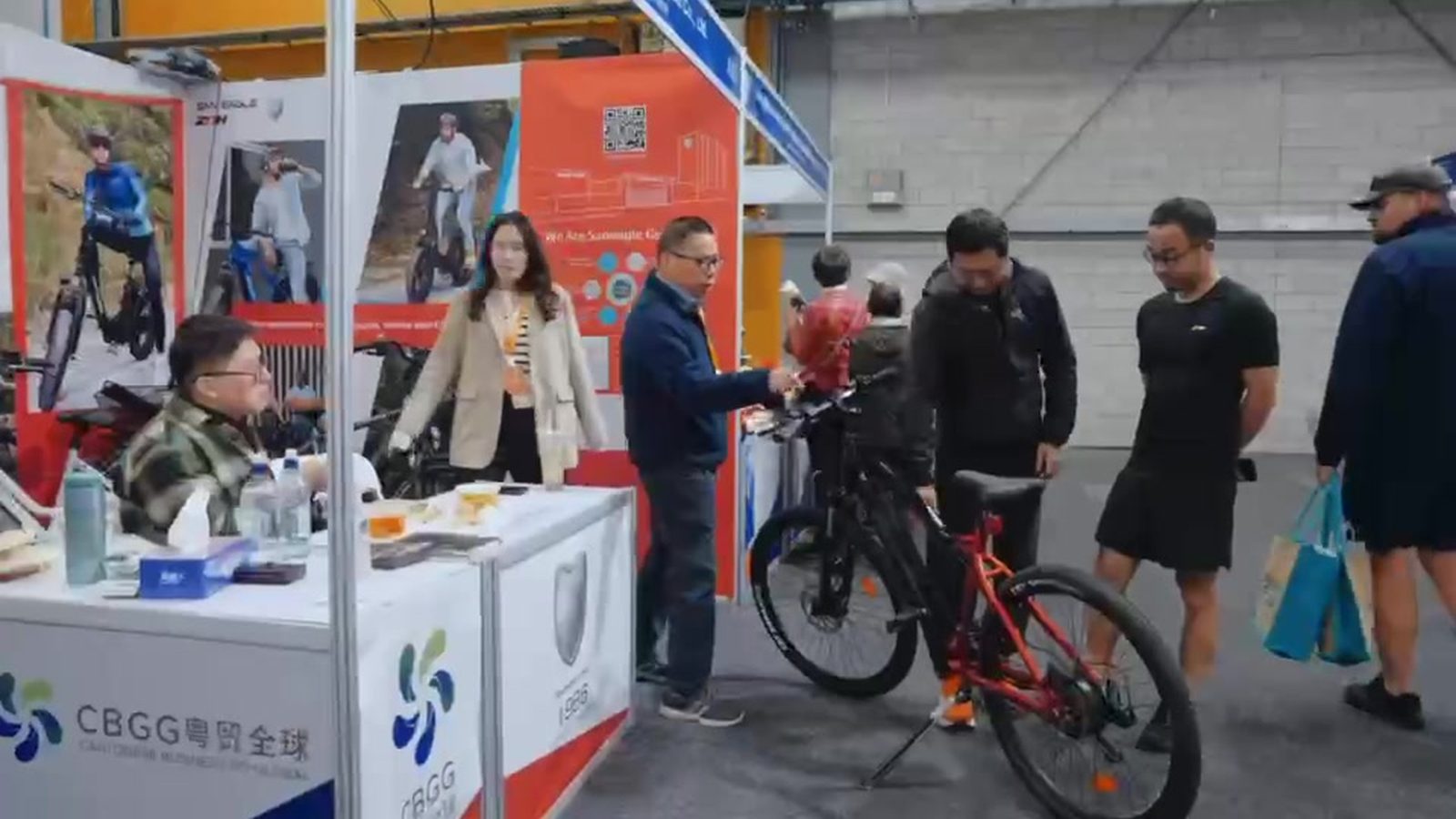 Buyers engaging at exhibitor booth